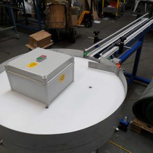 rotary table to belt conveyor