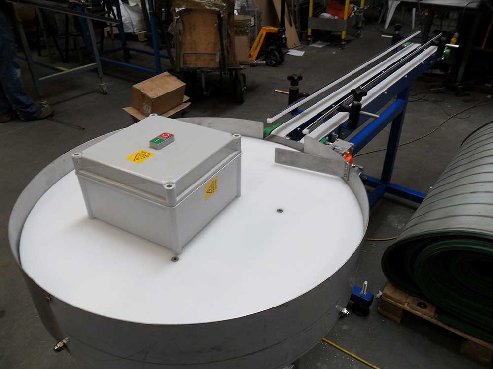 rotary table to belt conveyor
