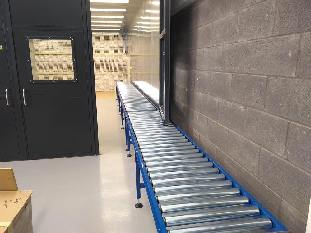 gravity roller conveyor built to fit under door