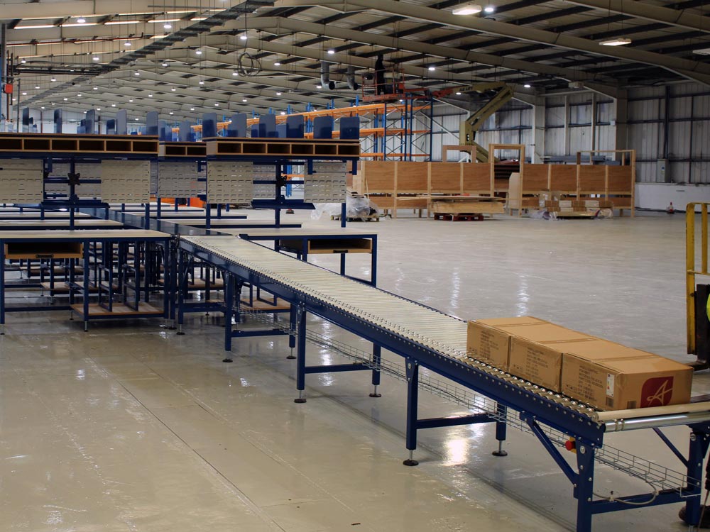 packing system installed with gravity roller conveyor